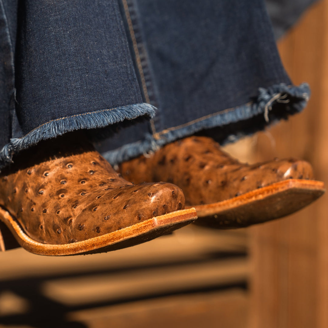 Close up detail of brown full-quill ostrich leather vamp on a pair of cowboy boots