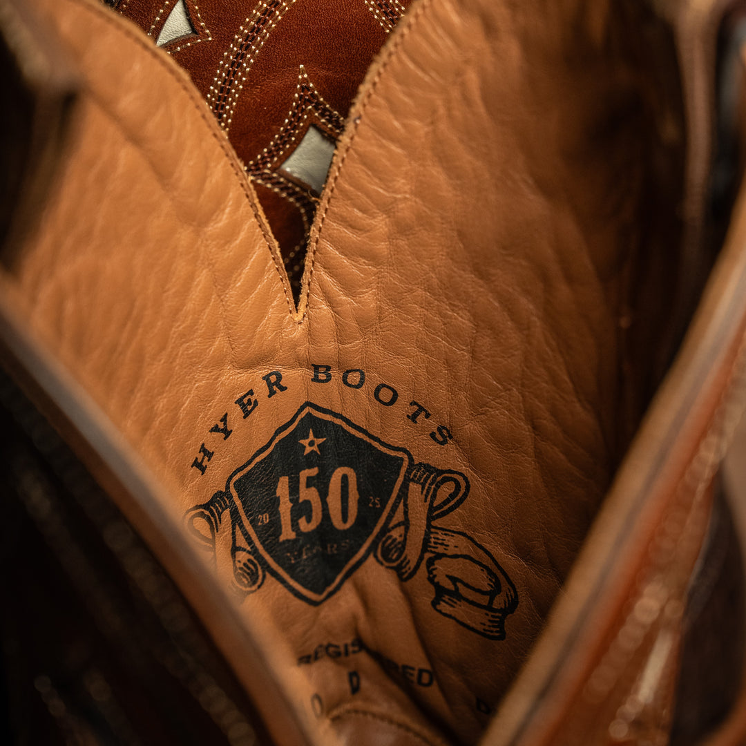 Close-up of interior of a brown leather boot with 'Hyer Boots' branding and '150' logo.