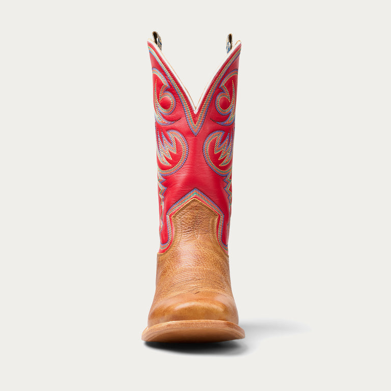 Cowboy boot with red top and brown bottom on a white background