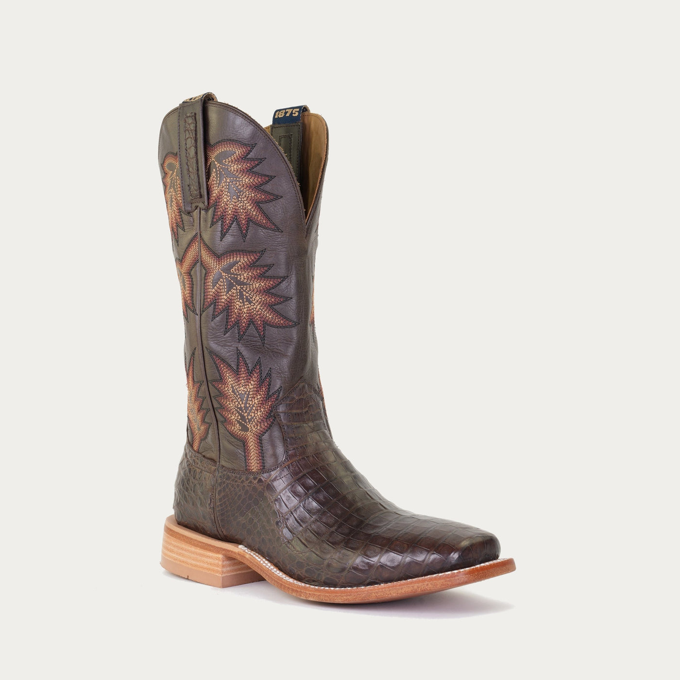 A brown caiman crocodile skin boot with a orange and yellow stitch design and a square toe.