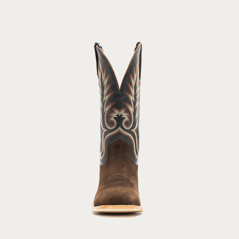 Brown and slate gray cowboy boot with decorative pattern on a light gray background