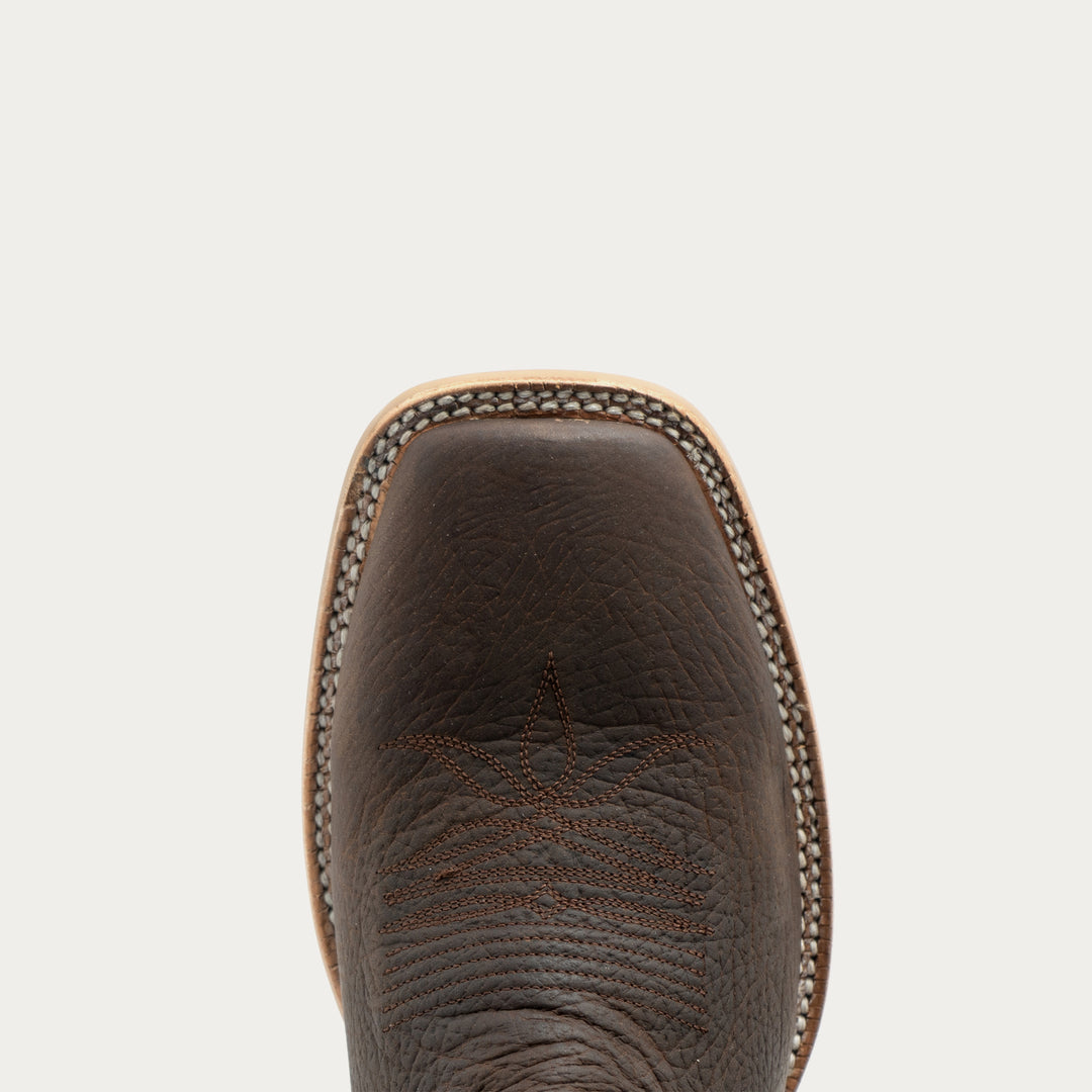 Close up of broad square toe cowboy boot toe on a white background