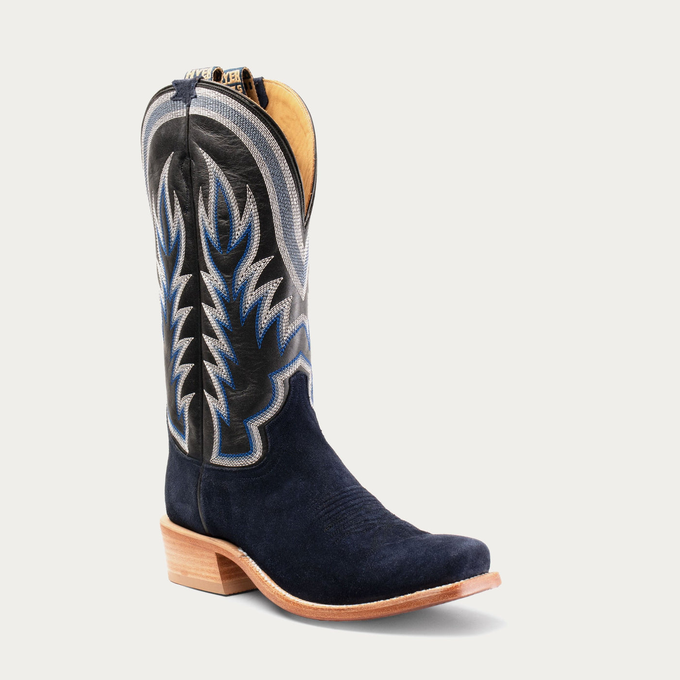 A navy blue cowboy boot with detailed stitching and a cutter toe. Shaft features black leather and white and navy stitching.