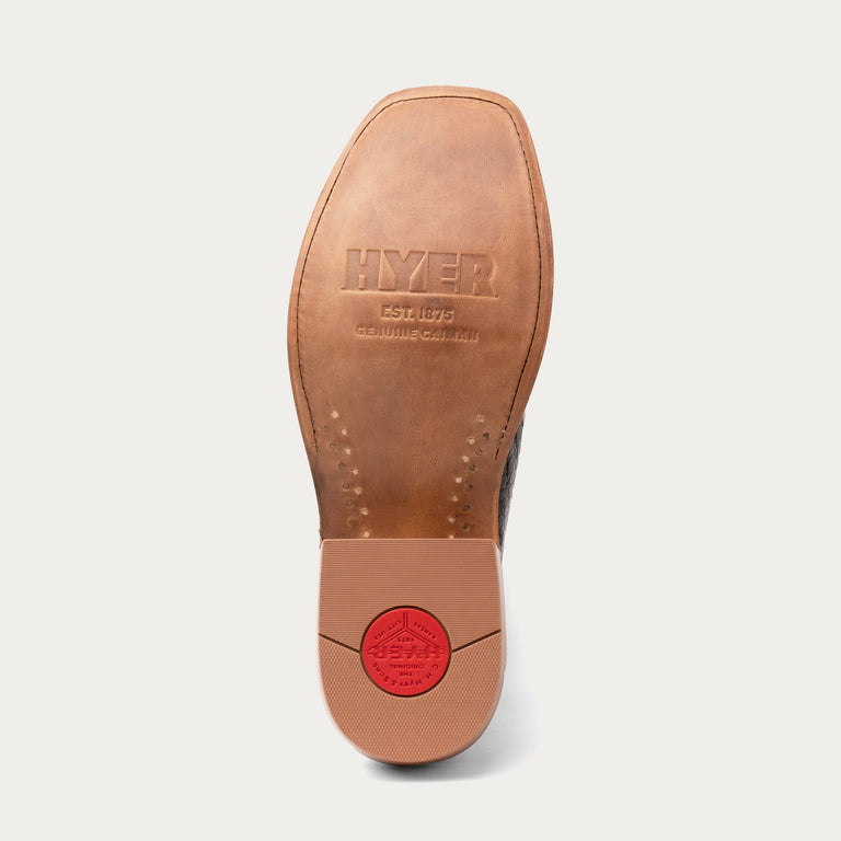 Brown leather shoe sole with HYER branding on a white background