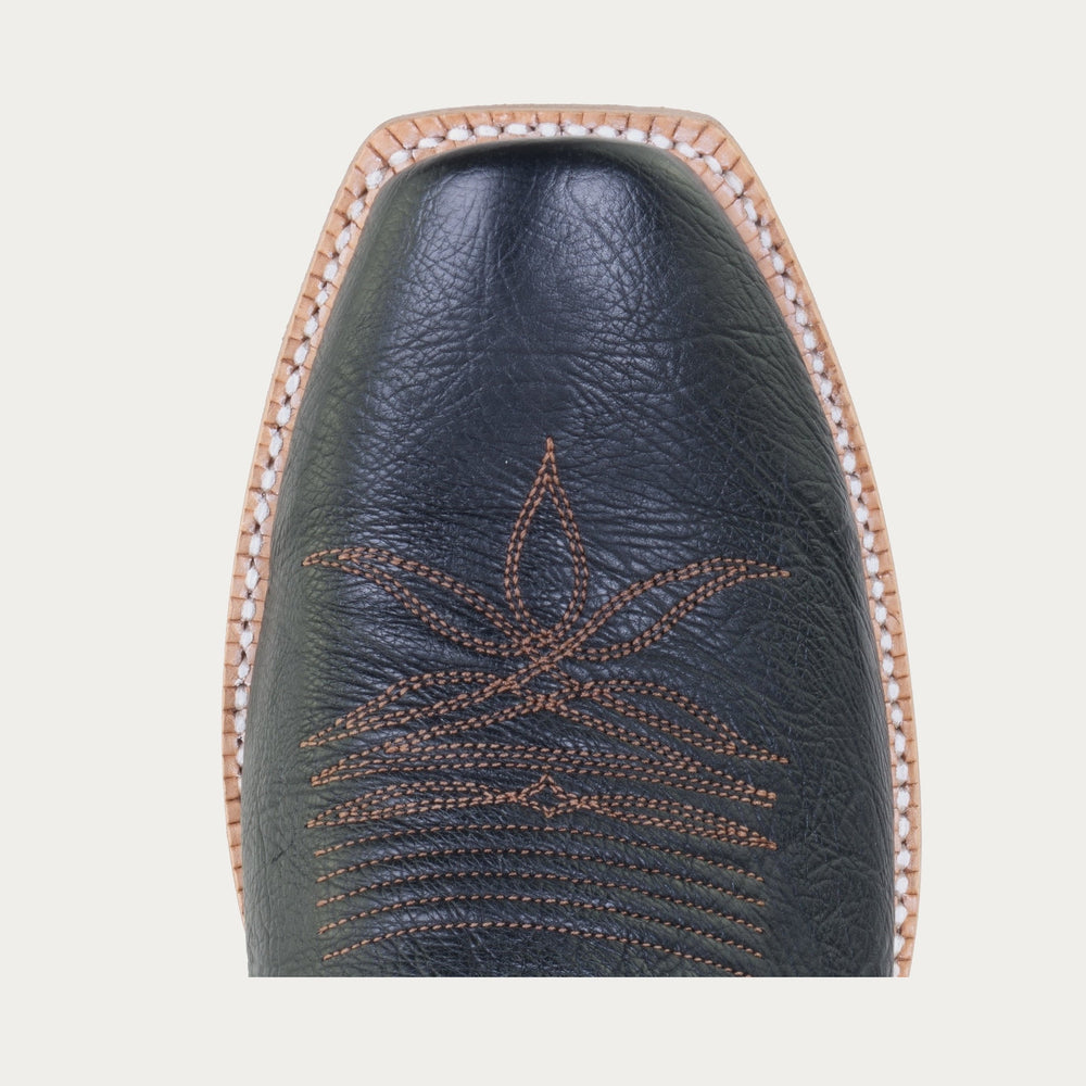 Toe of black cowboy boot with brown stitching 