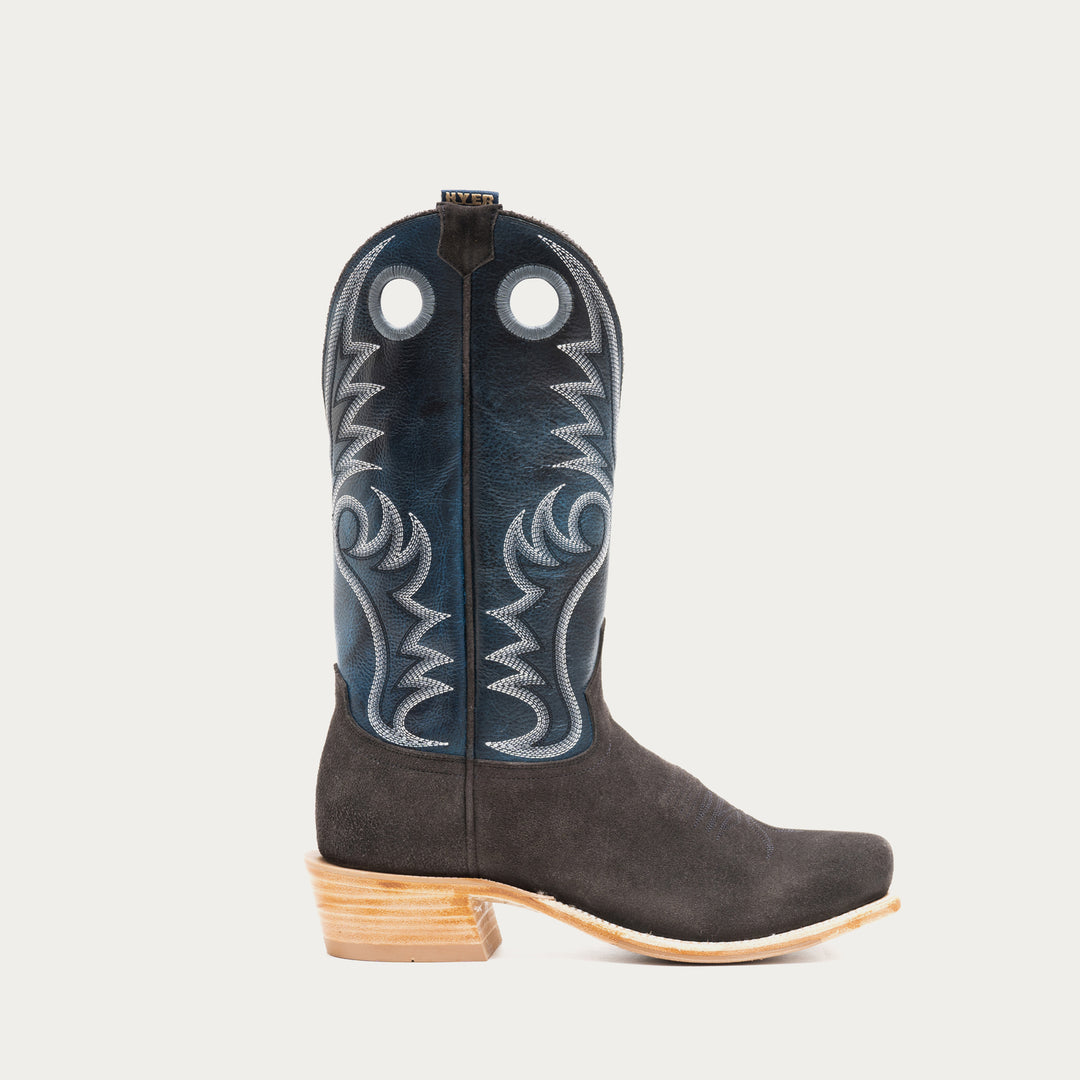 Blue and charcoal gray cowboy boot with blue embroidered design on a light gray background