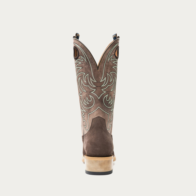 Chocolate brown and taupe cowboy boot with brown and light blue intricate stitching on light gray background