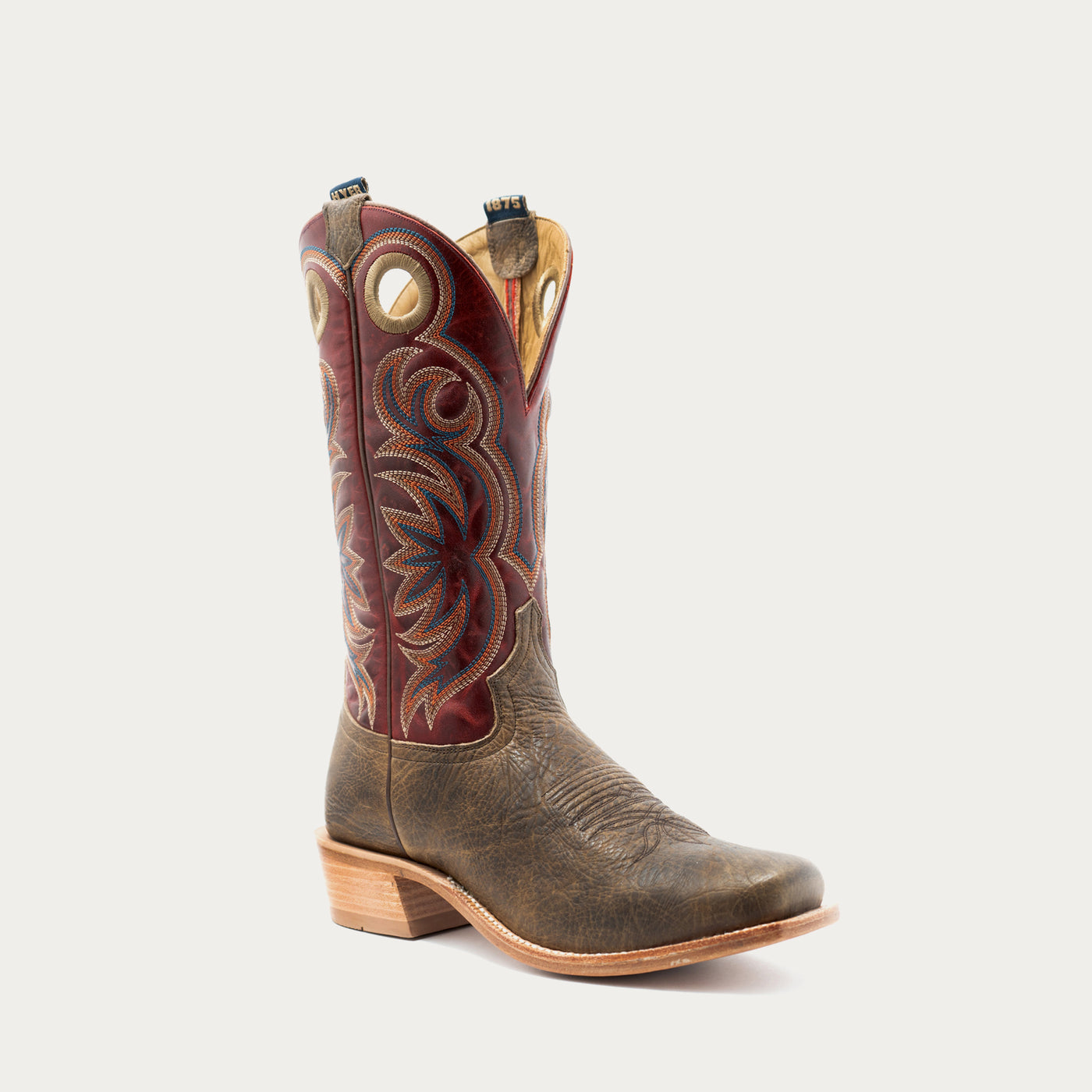 A single western cowboy boot with a distressed brown leather lower body and a dark red embroidered shaft, shown against a light gray background.