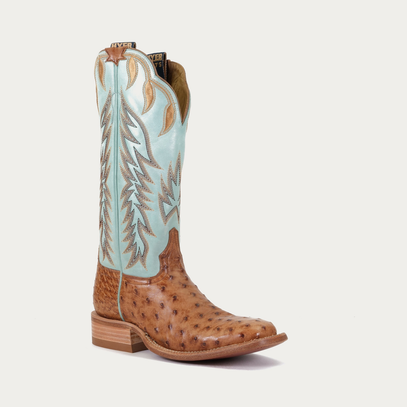 A women's boot with a brown toe box and a turquoise upper. The shaft shows is made of ostrich, featuring the texture and details of the material.