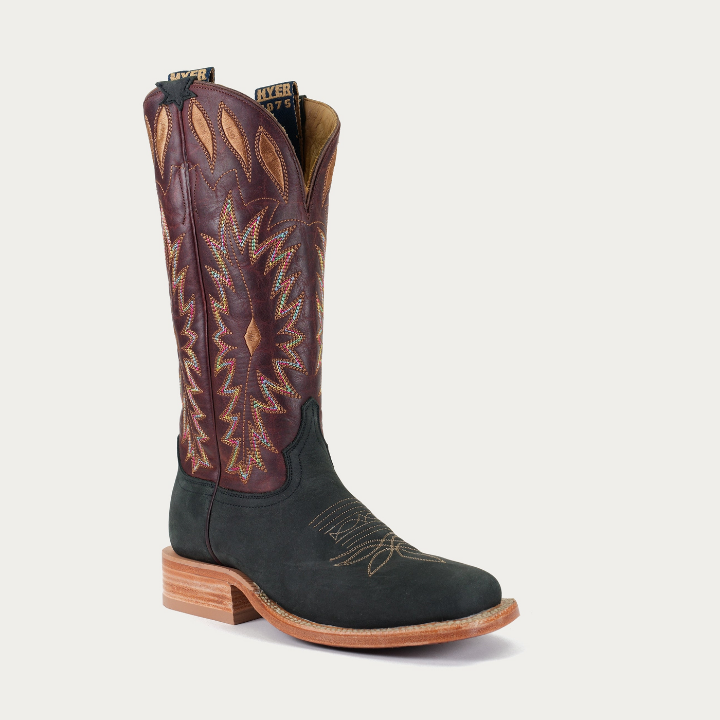 A women's Cherryvale boot featuring a smooth leather texture with a geometric pattern in purple and brown colors on the top, set against a white background.