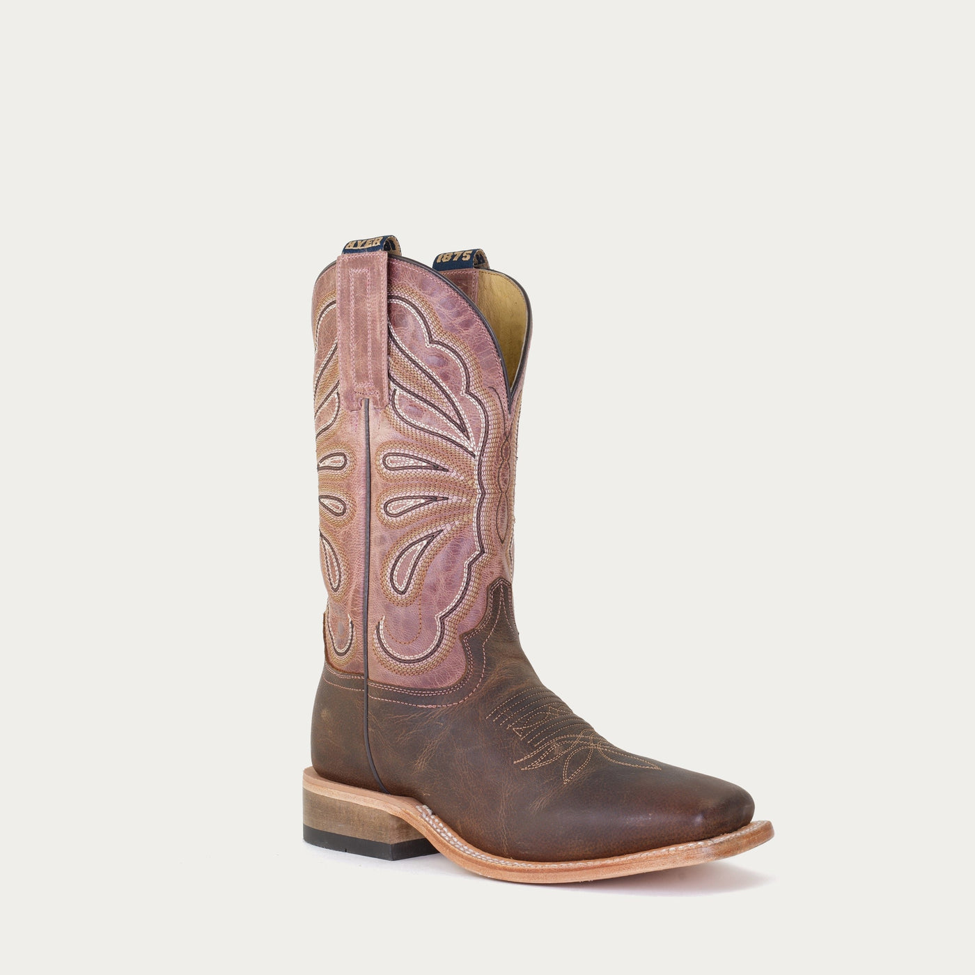 A brown and pink cowgirl boot featuring a vintage butterfly pattern.
