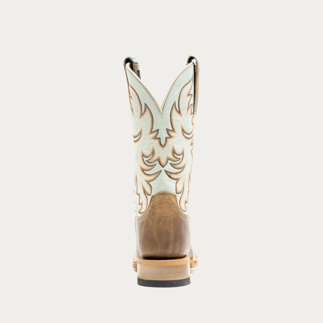 Brown and light blue cowboy boot with tan and brown embroidery on a light gray background