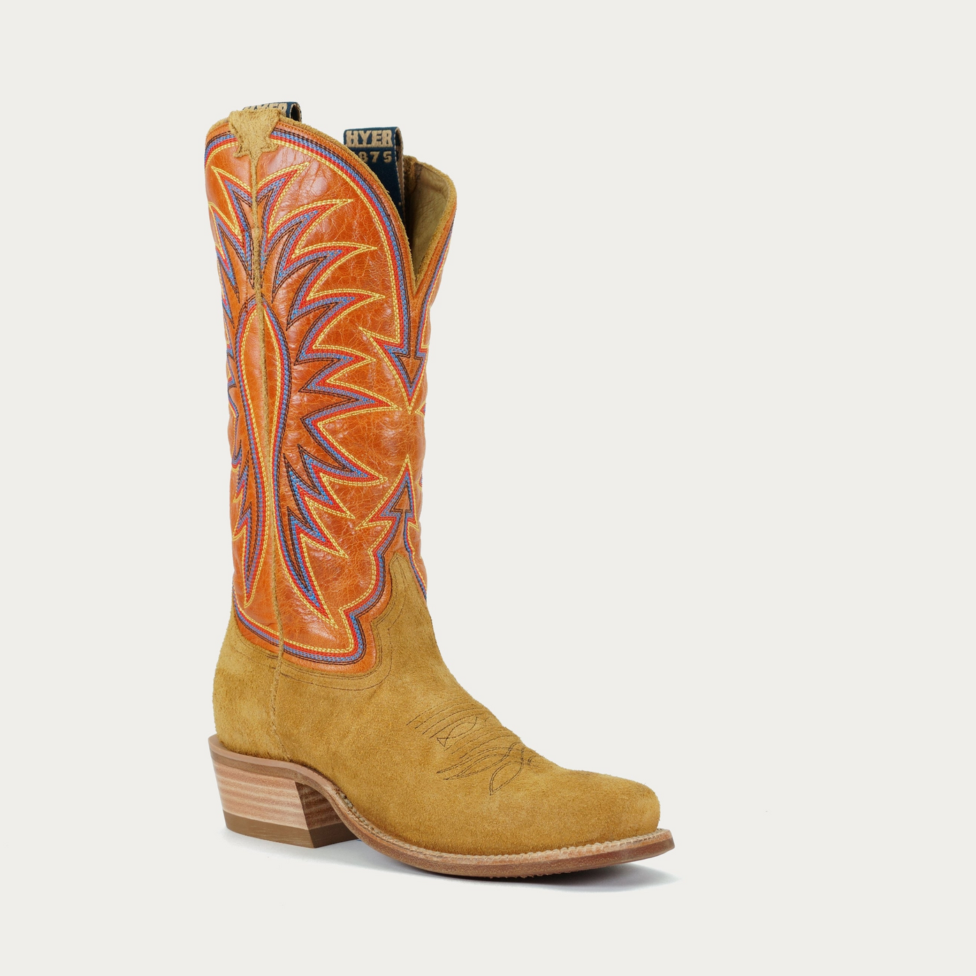 A women's Rose Hill boot featuring a tan and orange color scheme with intricate multicolored stitching.