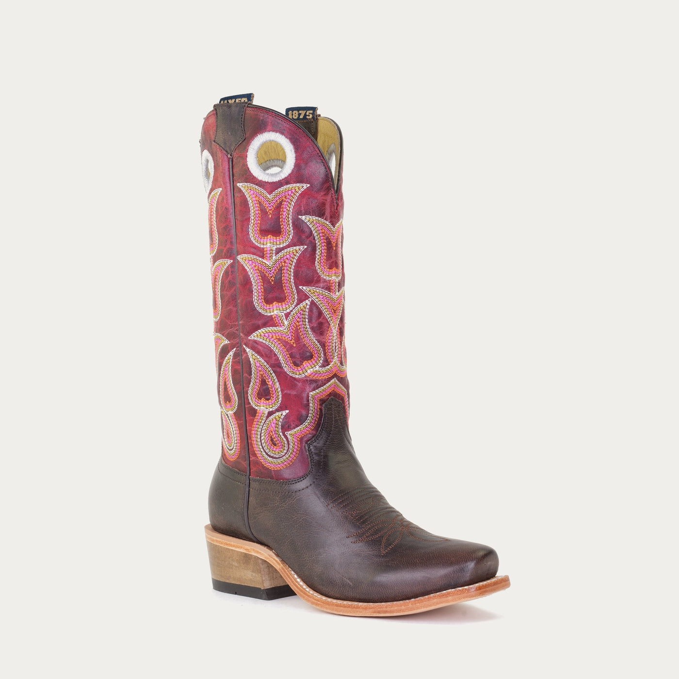 A women's brown boot with a red and pink floral pattern on the upper and a square toe.