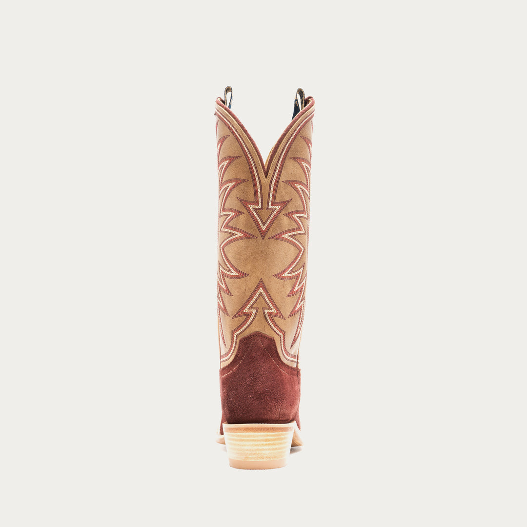 Burgundy and tan cowboy boot with intricate design on a gray background