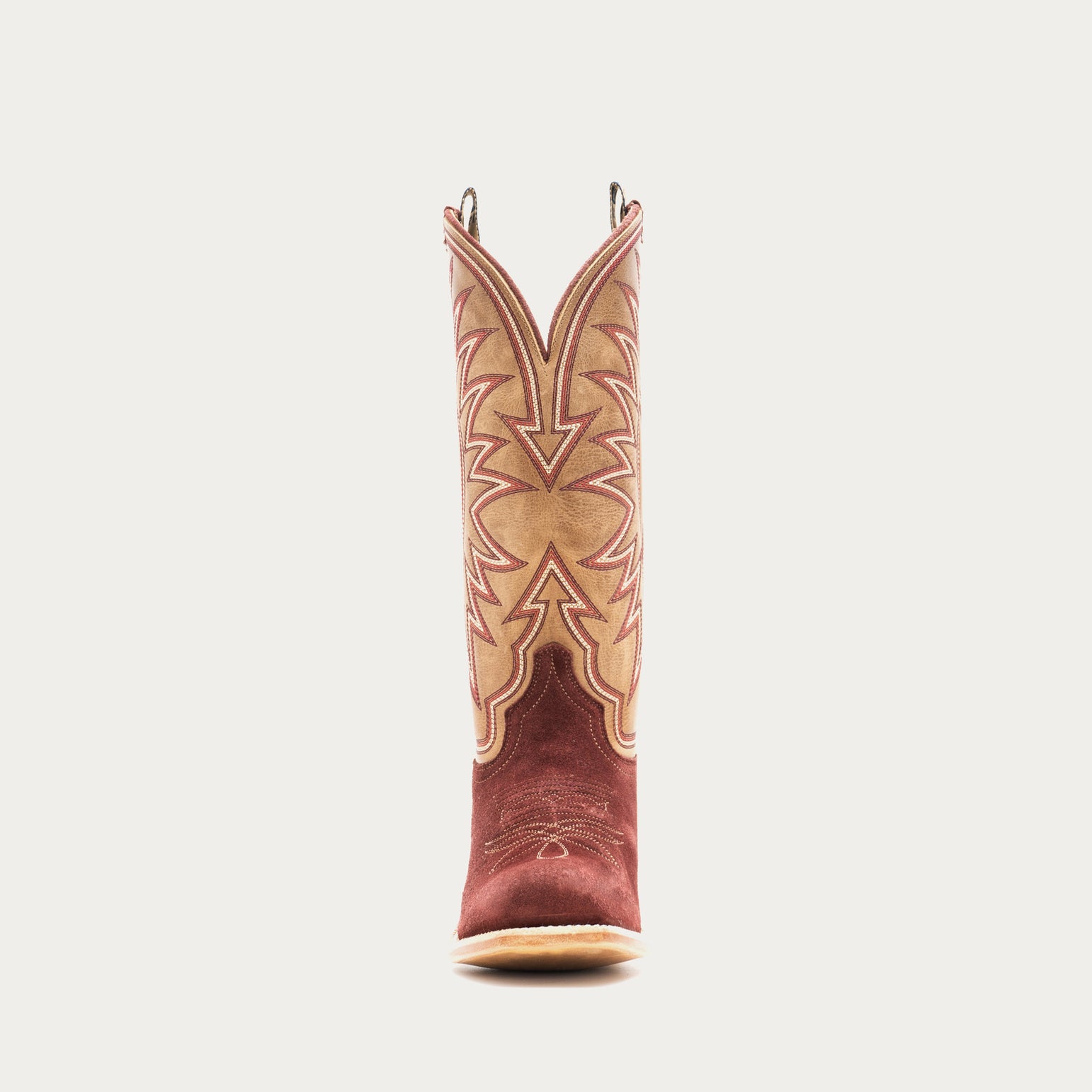 Burgundy and tan cowboy boot with intricate design on a light gray background