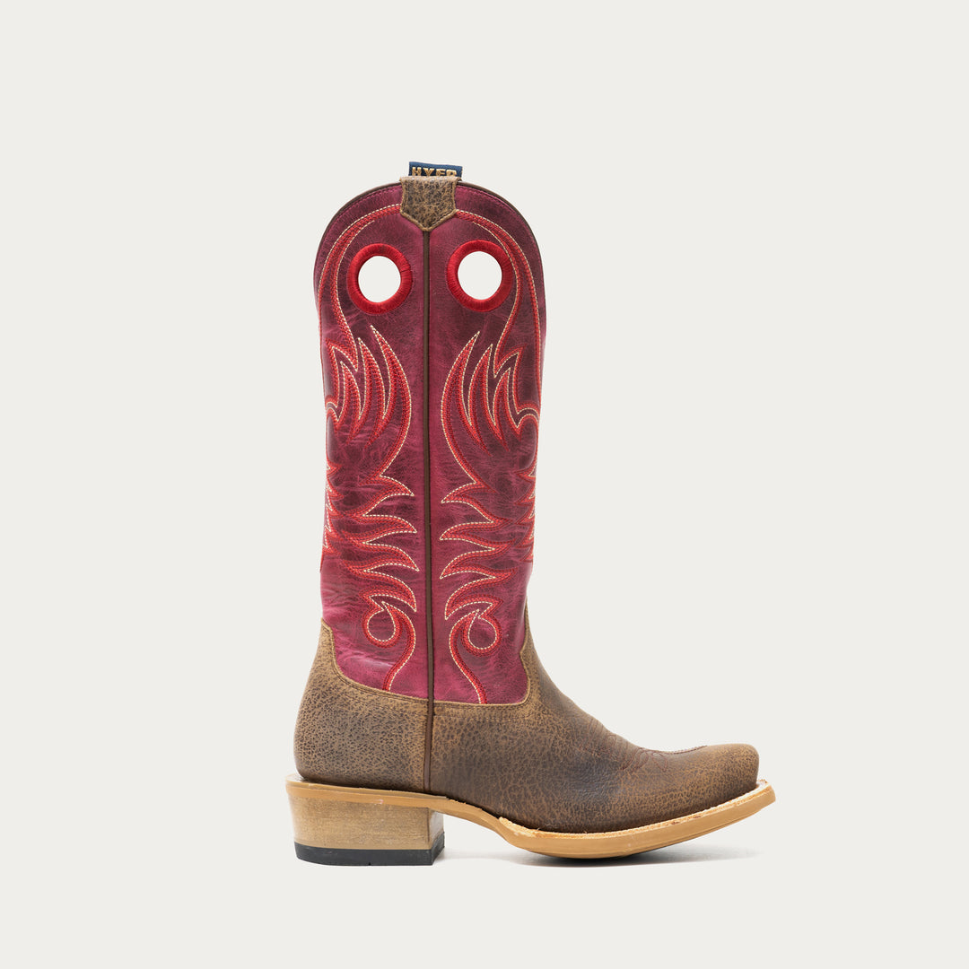 Brown and dark pink cowboy boot on a light gray background