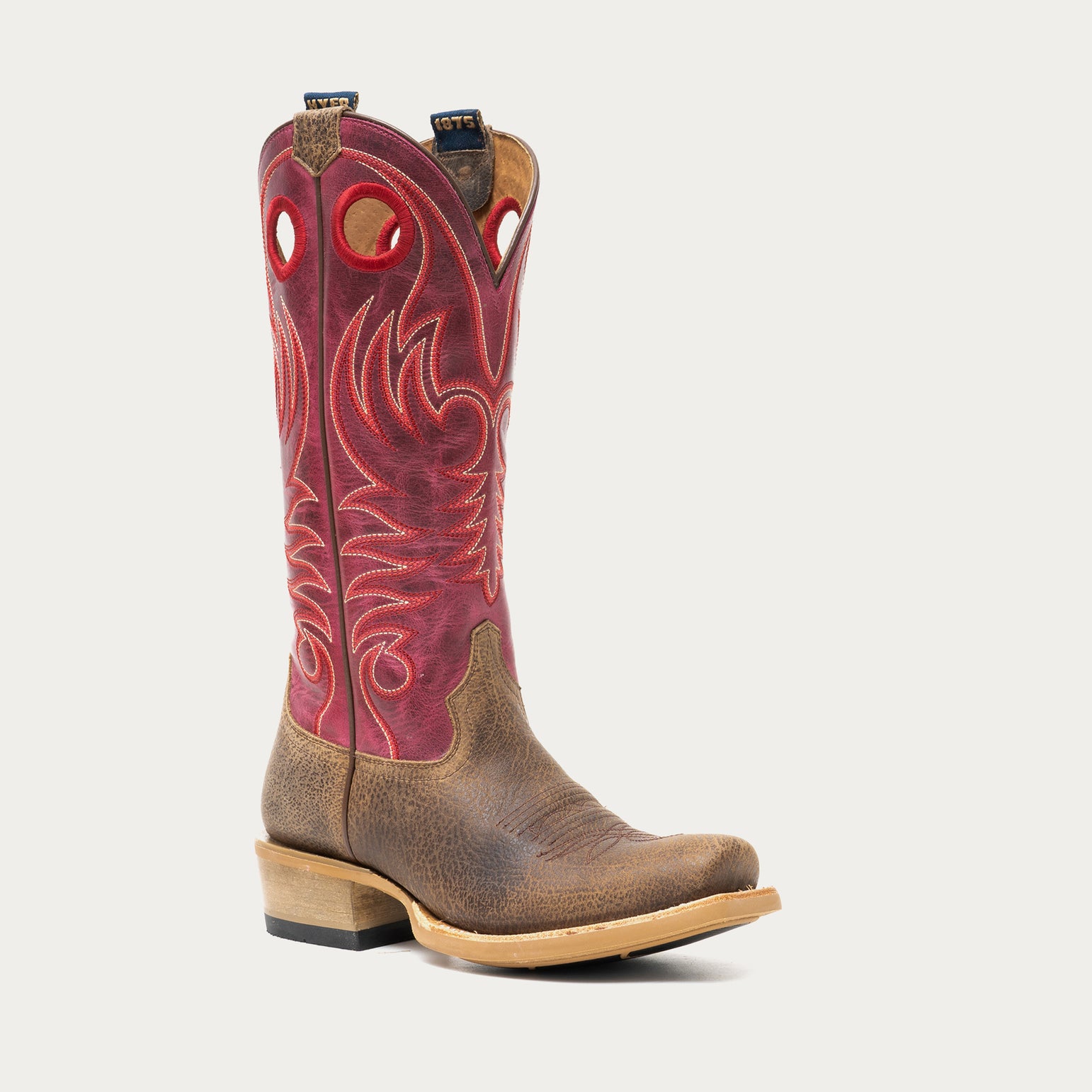 Brown and dark pink cowboy boot on a light gray background