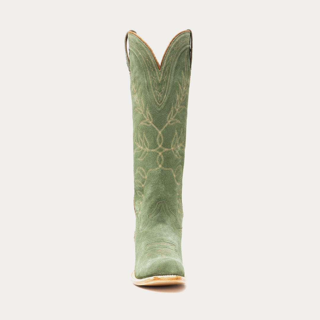Tall green cowboy boot on a light gray background