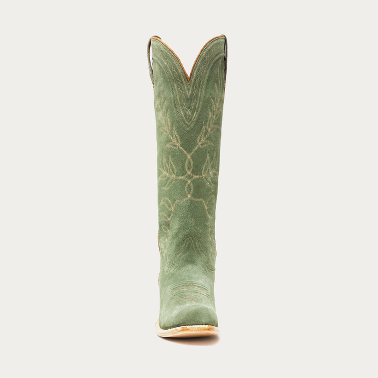 Tall green cowboy boot on a light gray background
