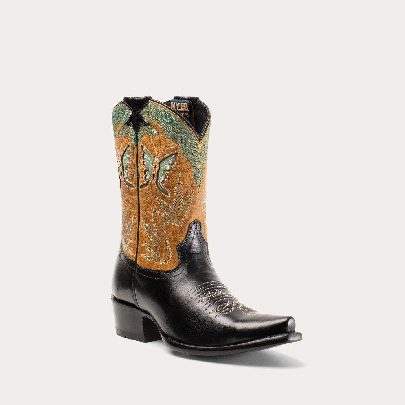 A women's cowboy boot with black leather uppers, colorful butterfly inlays on the sides, and a snipped toe.