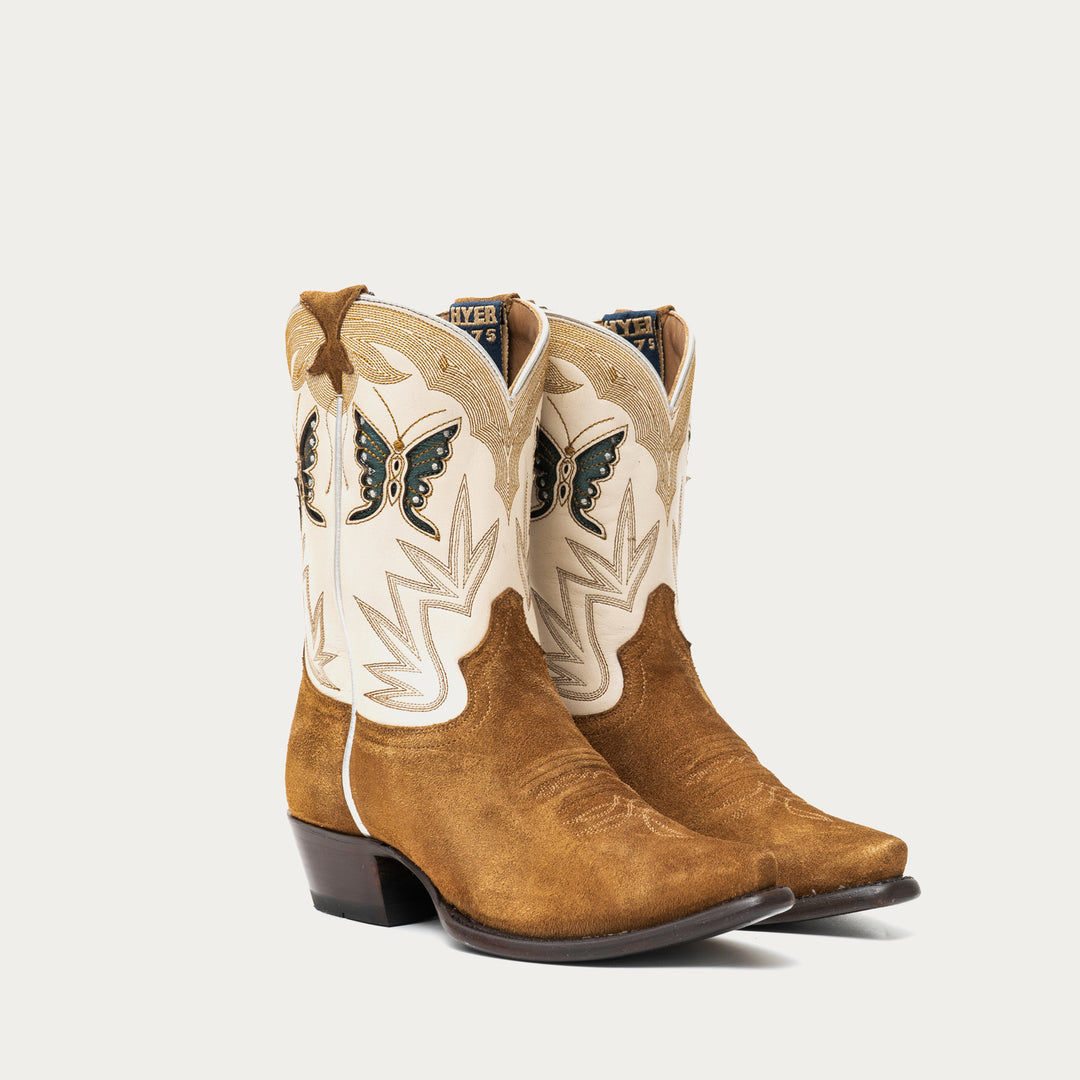 Pair of brown and white cowboy boots with stitching and butterfly designs on a light gray background