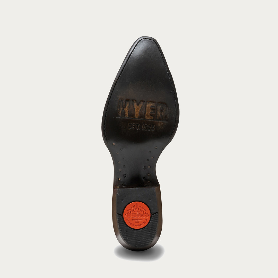 Close-up of a black leather shoe sole with 'Hyer' branding on a light gray background