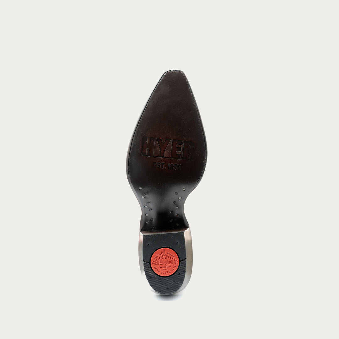 Black shoe sole with a red label on a light gray background