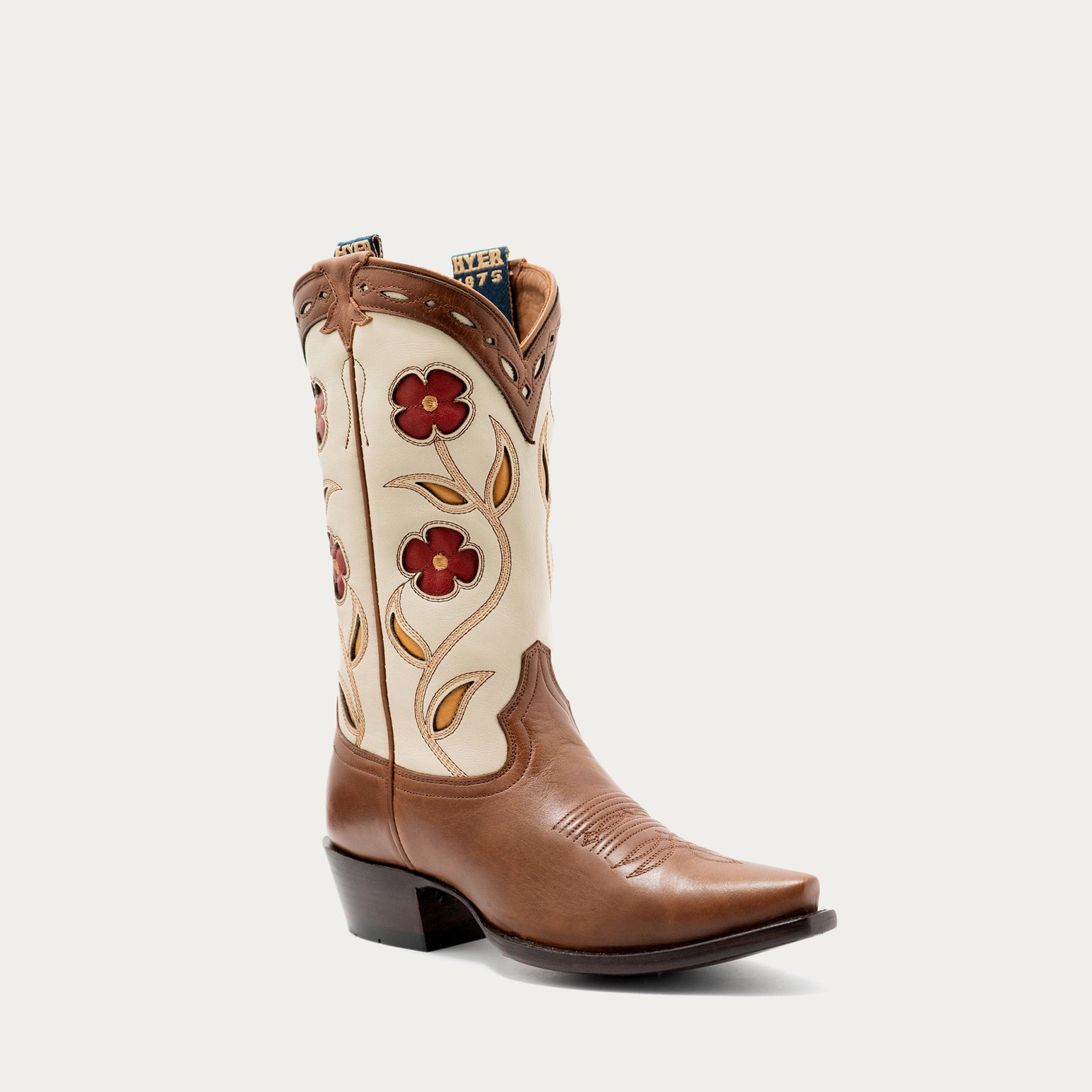 Brown and tan cowboy boot with floral designs on a white background