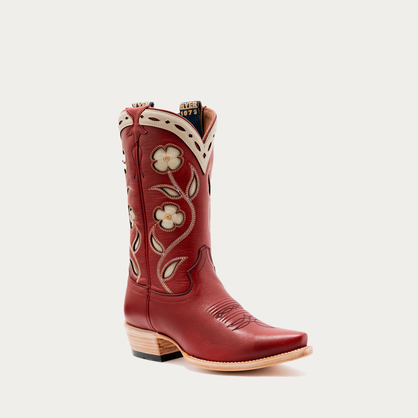 Red cowboy boot with floral embroidery on a white background