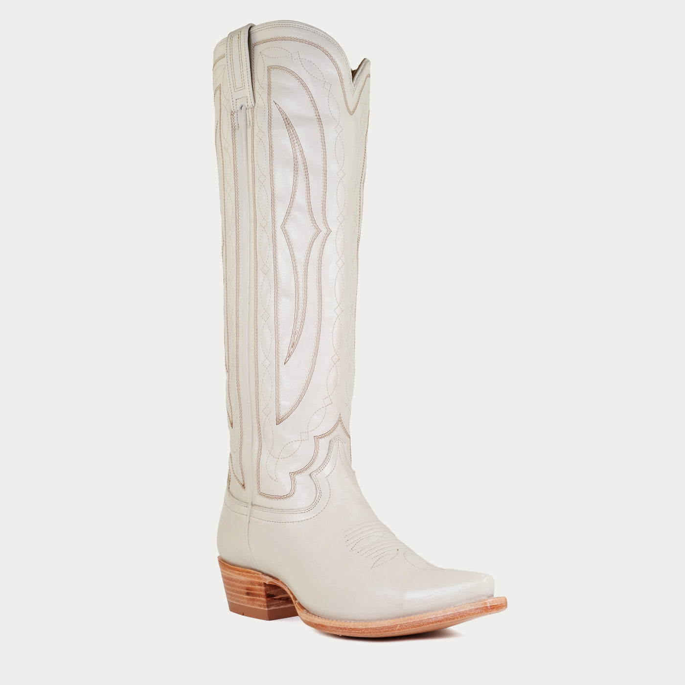 White cowboy boot on a light gray background