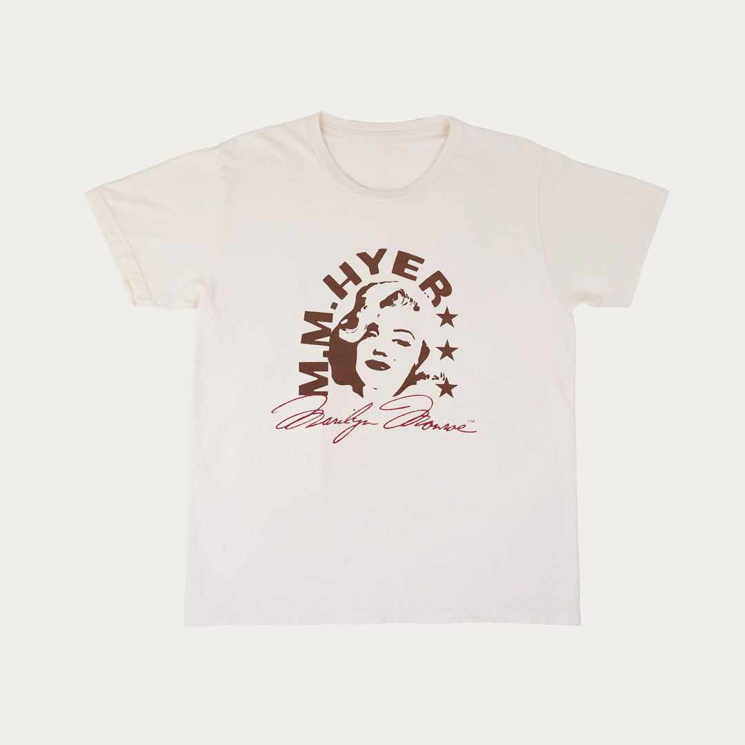 White short sleeve crew neck t-shirt with Marilyn Monroe silhouette and text on a white background