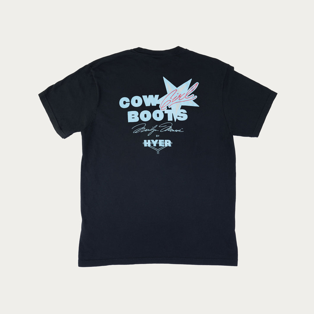 Back of black short sleeve crew neck short sleeve t-shirt with blue and red graphic print with the text "CowGirl Boots Marilyn Monroe x Hyer"